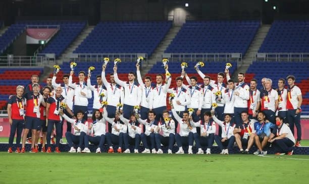 Silver medalists of Team Spain celebrate on the podium with their medals during the Men's Football Competition Medal Ceremony on day fifteen of the...
