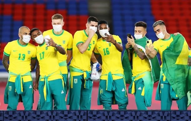 Gold medalists of Team Brazil celebrate with their gold medals during the Men's Football Competition Medal Ceremony on day fifteen of the Tokyo 2020...
