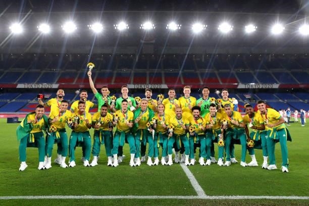 Gold medalists of Team Brazil pose for a photograph with their gold medals during the Men's Football Competition Medal Ceremony on day fifteen of the...