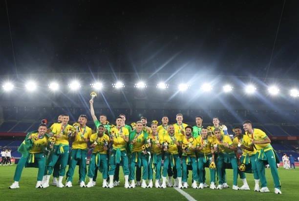 Gold medalists of Team Brazil pose for a photograph with their gold medals during the Men's Football Competition Medal Ceremony on day fifteen of the...