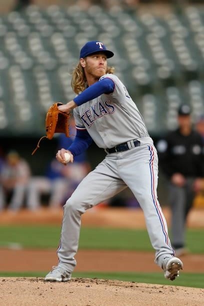 Mike Foltynewicz of the Texas Rangers pitches in the bottom of the first inning against the Oakland Athletics at RingCentral Coliseum on August 06,...