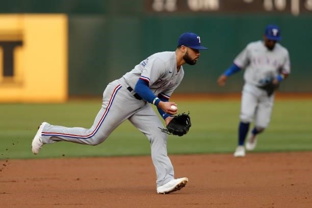Isiah Kiner-Falefa of the Texas Rangers fields the ball against the Oakland Athletics at RingCentral Coliseum on August 06, 2021 in Oakland,...