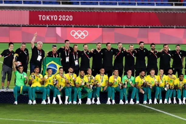 Players of Team Brazil celebrate after the award ceremony of the Men's Gold Medal Match between Team Brazil and Team Spain on day fifteen of the...