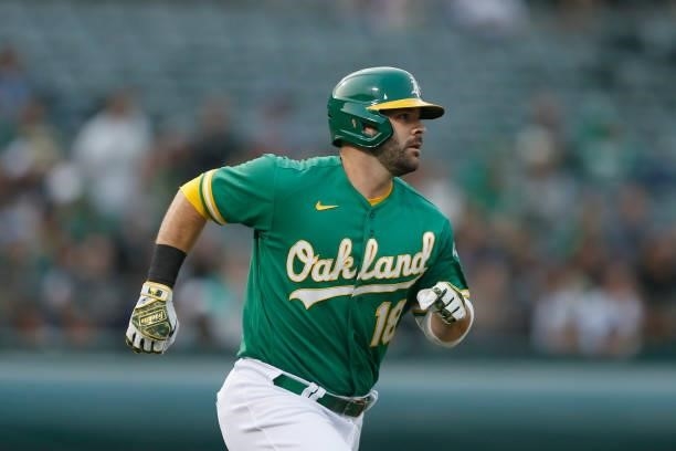 Mitch Moreland of the Oakland Athletics runs to first base against the Texas Rangers at RingCentral Coliseum on August 06, 2021 in Oakland,...