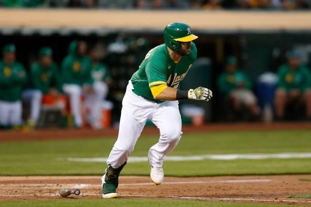 Mitch Moreland of the Oakland Athletics runs to first base against the Texas Rangers at RingCentral Coliseum on August 06, 2021 in Oakland,...