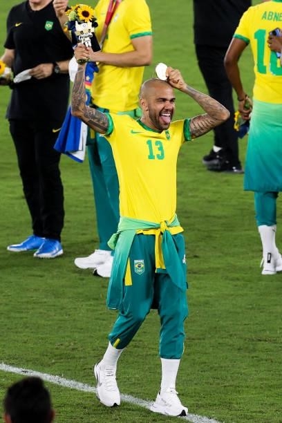Dani Alves of Team Brazil celebrates after the award ceremony of the Men's Gold Medal Match between Team Brazil and Team Spain on day fifteen of the...