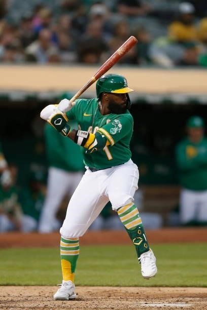 Josh Harrison of the Oakland Athletics at bat against the Texas Rangers at RingCentral Coliseum on August 06, 2021 in Oakland, California.