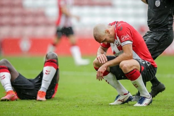 Oriol Romeu of Southampton is forced to leave the field after a head collision with team-mate Mohammed Salisu leaves him with a cut to the forehead...