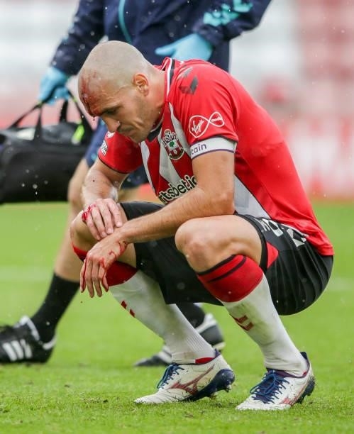 Oriol Romeu of Southampton is forced to leave the field after a head collision with team-mate Mohammed Salisu leaves him with a cut to the forehead...