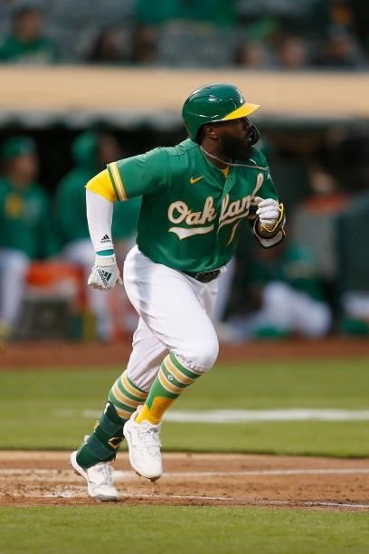 Josh Harrison of the Oakland Athletics at bat against the Texas Rangers at RingCentral Coliseum on August 06, 2021 in Oakland, California.