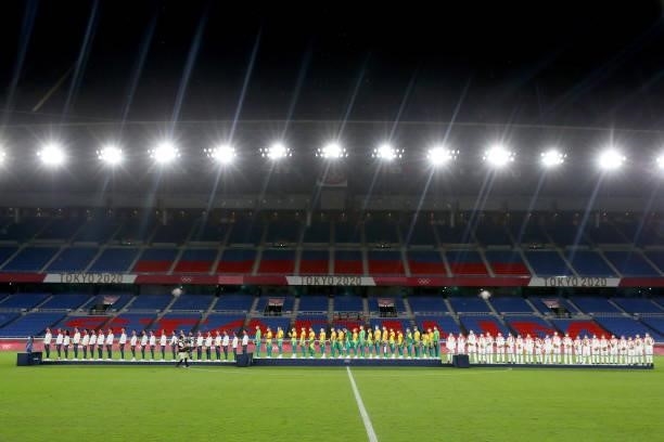 Silver medalists of Team Spain, Gold medalists of Team Brazil and Bronze medalists of Team Mexico stand on the podium as the empty stadium can be...