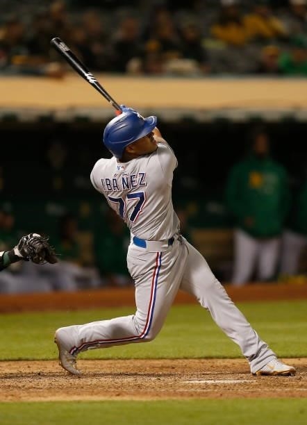 Andy Ibanez of the Texas Rangers at bat against the Oakland Athletics at RingCentral Coliseum on August 06, 2021 in Oakland, California.