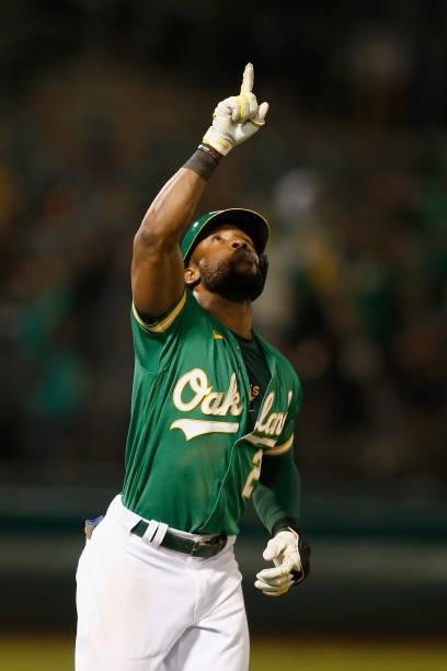 Starling Marte of the Oakland Athletics celebrates after hitting a walk-off three-run home run in the bottom of the eleventh inning against the Texas...