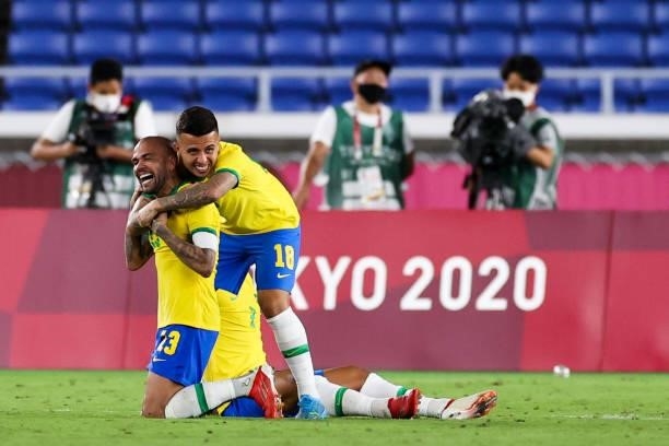 Dani Alves and Matheus Henrique of Team Brazil celebrate the victory after the Men's Gold Medal Match between Team Brazil and Team Spain on day...