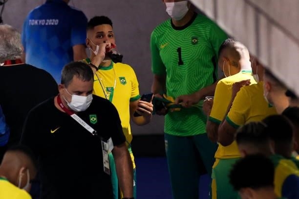 Paulinho of Brazil drinks coca cola after the Men's Gold Medal Match between Brazil and Spain on day fifteen of the Tokyo 2020 Olympic Games at...