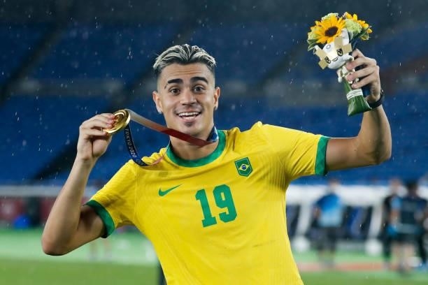 Reinier of Brazil celebrates after the award ceremony of the Men's Gold Medal Match between Brazil and Spain on day fifteen of the Tokyo 2020 Olympic...