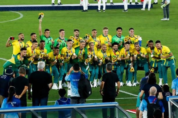 Players of Brazil celebrate after the award ceremony of the Men's Gold Medal Match between Brazil and Spain on day fifteen of the Tokyo 2020 Olympic...
