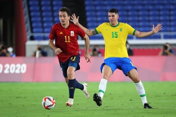 Mikel Oyarzabal of Team Spain controls the ball against Nino of Team Brazil in the first half during the men's gold medal match between Team Brazil...