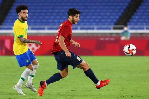 Marco Asensio of Team Spain follows the ball against Claudinho of Team Brazil in the first half during the men's gold medal match between Team Brazil...