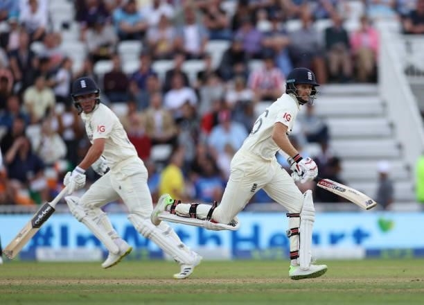 Joe Root of England runs a single with Sam Curran during day four of the First LV= Insurance test match between England and India at Trent Bridge on...