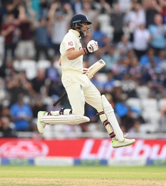 Joe Root of England leaps as he celebrates reaching his century during the fourth day of the 1st LV= Test match between England and India at Trent...