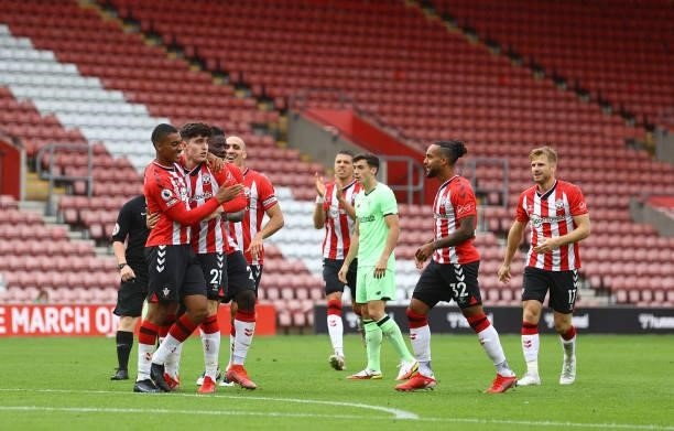 Southampton players celebrate with Tino Livramento after he assisted Theo Walcott for Southampton's goal during the pre season friendly match between...