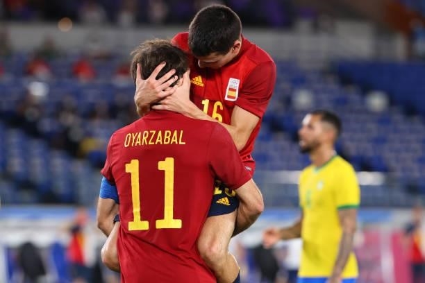 Mikel Oyarzabal celebrates with Pedri Gonzalez of Team Spain after scoring a goal in the second half to tie the game 1-1 during the men's gold medal...