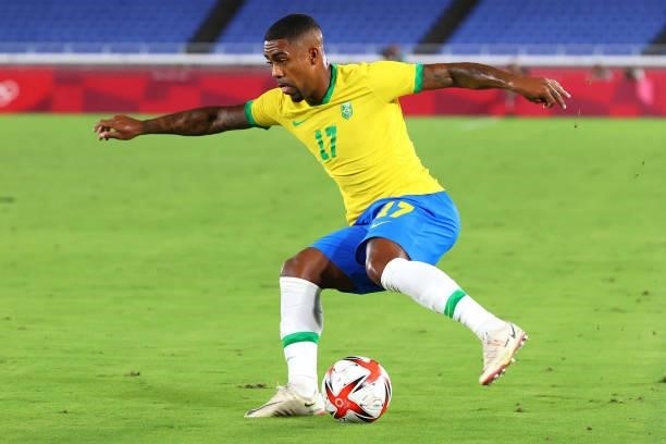 Malcolm of Team Brazil controls the ball during the first period of extra time during the men's gold medal match between Team Brazil and Team Spain...