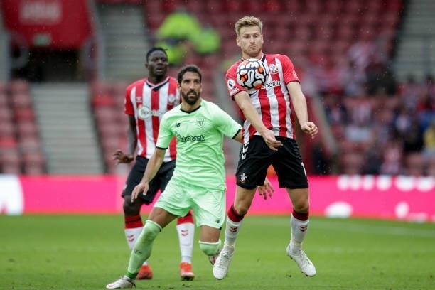 Stuart Armstrong of Southampton with Asier Villalibre of Athletic Bilbao during a pre-season friendly between Southampton FC and Athletic Bilbao at...