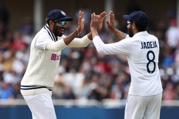 Ravindra Jadeja of India celebrates catching Jonny Bairstow of England with Jasprit Bumrah during day four of the First LV= Insurance test match...