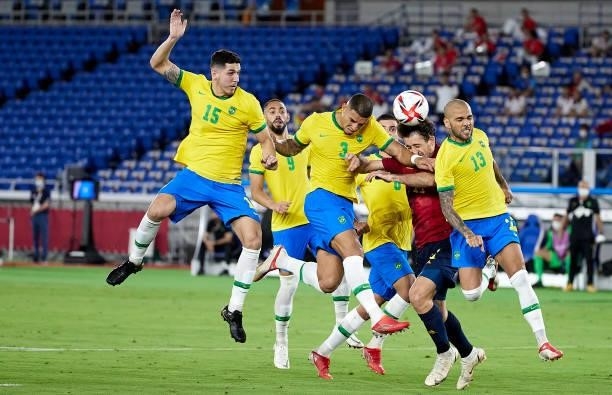Mikel Oyarzabal of Team Spain competes for the ball with Diego Carlos Santos and Daniel Alves of Team Brazil during the Men's Gold Medal Match...
