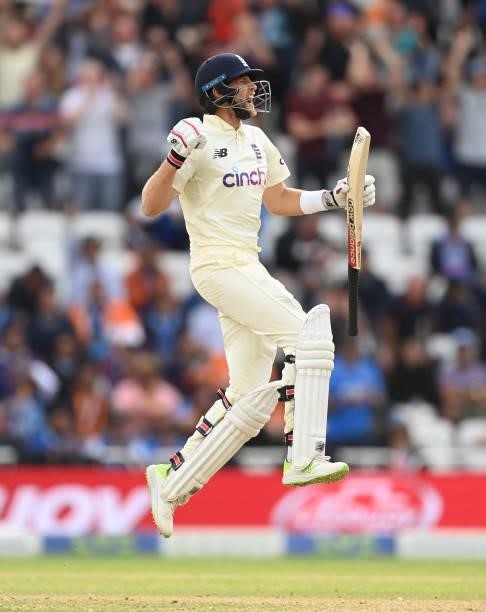 Joe Root of England leaps as he celebrates reaching his century during the fourth day of the 1st LV= Test match between England and India at Trent...