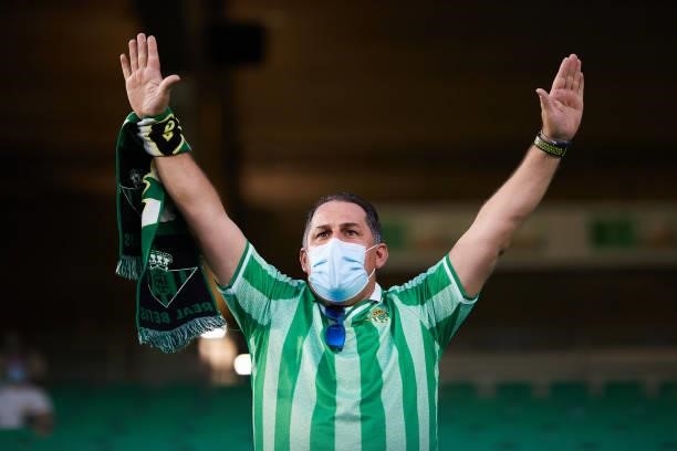 Real Betis fan cheer during a friendly match between Real Betis and AS Roma at Estadio Benito Villamarin on August 07, 2021 in Seville, Spain.