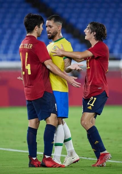 Douglas Luiz of Team Brazil argues with Carlos Soler of Team Spain during the Men's Gold Medal Match between Team Brazil and Team Spain on day...