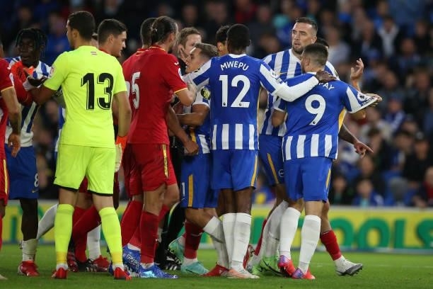 Neal Maupay of Brighton & Hove Albion is ushered away by his team mates after an altercation with Chema of Getafe during the Pre-Season Friendly...