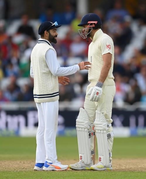 Virat Kohli of India talks to James Anderson of England during the fourth day of the 1st LV= Test match between England and India at Trent Bridge on...