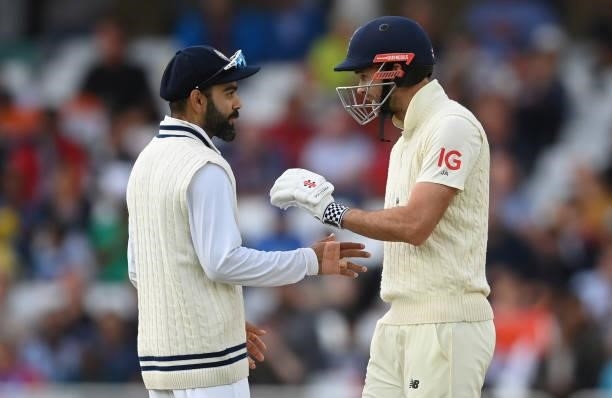 Virat Kohli of India talks to James Anderson of England during the fourth day of the 1st LV= Test match between England and India at Trent Bridge on...