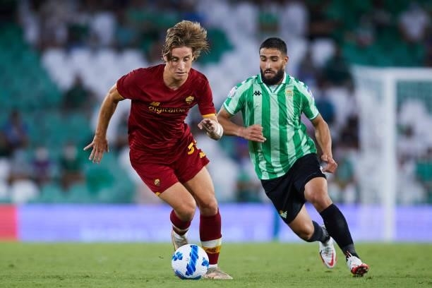 Nabil Fekir of Real Betis competes for the ball with Edoardo Bove of AS Roma during a friendly match between Real Betis and AS Roma at Estadio Benito...