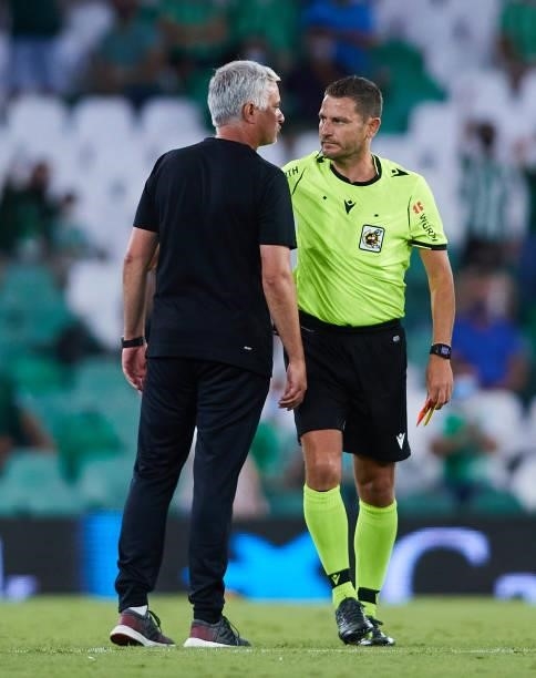 Jose Mourinho of AS Roma talks to the referee during a friendly match between Real Betis and AS Roma at Estadio Benito Villamarin on August 07, 2021...