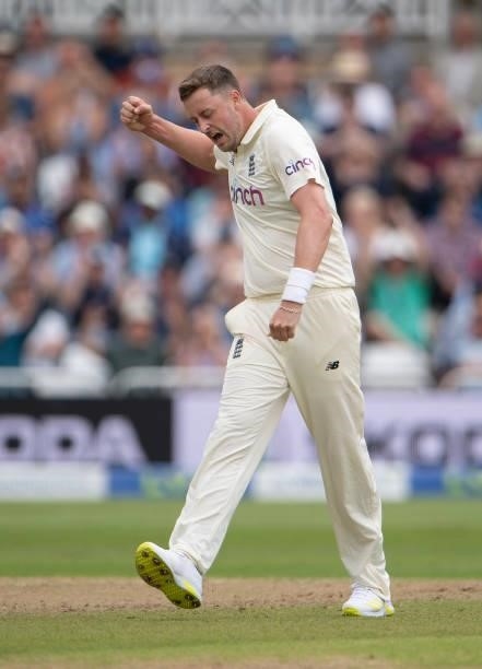 Ollie Robinson of England celebrates taking the wicket of Rohit Sharma of India during day two of the First Test Match between England and India at...