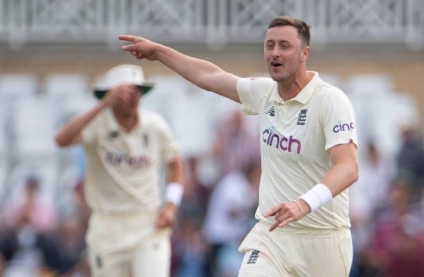 Ollie Robinson of England celebrates taking the wicket of Cheteshwar Pujara of India only for the decision to be overturned during day two of the...
