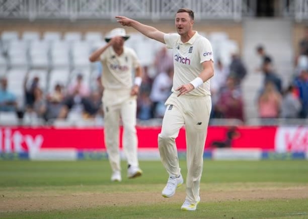 Ollie Robinson of England celebrates taking the wicket of Cheteshwar Pujara of India only for the decision to be overturned during day two of the...