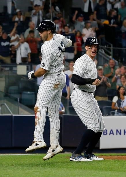 Joey Gallo of the New York Yankees celebrates his seventh inning three run home run against the Seattle Mariners with teammate Aaron Judge at Yankee...