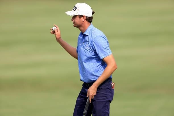 Harris English acknowledges the crowd on the 18th hole during the third round of the World Golf Championship-FedEx St Jude Invitational at TPC...