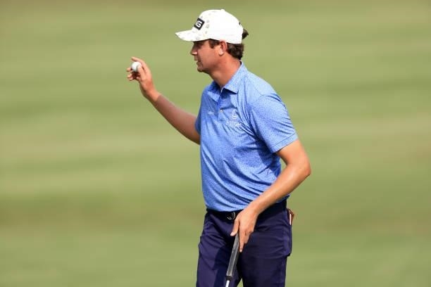 Harris English acknowledges the crowd on the 18th hole during the third round of the World Golf Championship-FedEx St Jude Invitational at TPC...