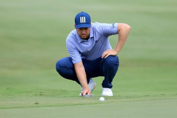 Daniel Berger looks over a shot on the 16th hole during the third round of the World Golf Championship-FedEx St Jude Invitational at TPC Southwind on...