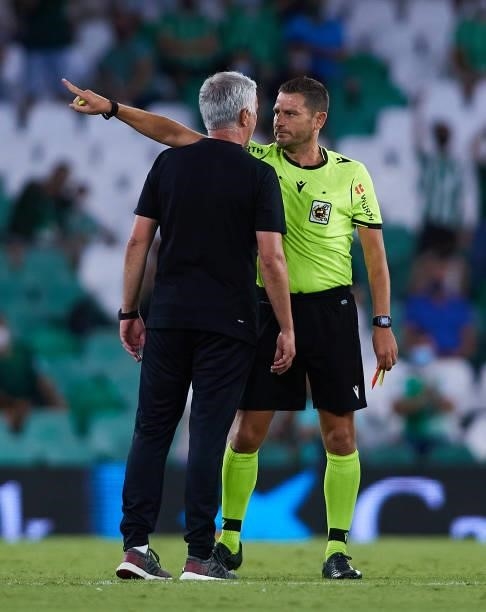 Jose Mourinho of AS Roma talks to the referee during a friendly match between Real Betis and AS Roma at Estadio Benito Villamarin on August 07, 2021...
