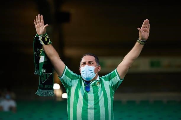 Real Betis fan cheer during a friendly match between Real Betis and AS Roma at Estadio Benito Villamarin on August 07, 2021 in Seville, Spain.