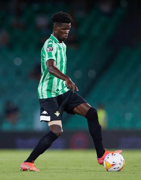 Paul Akouokou of Real Betis in action during a friendly match between Real Betis and AS Roma at Estadio Benito Villamarin on August 07, 2021 in...