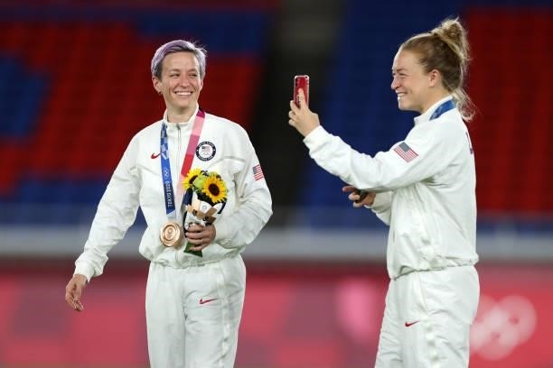 Megan Rapinoe and Emily Sonnett of Team USA celebrate with their bronze medals after the Gold Medal Match Women's Football match between Canada and...